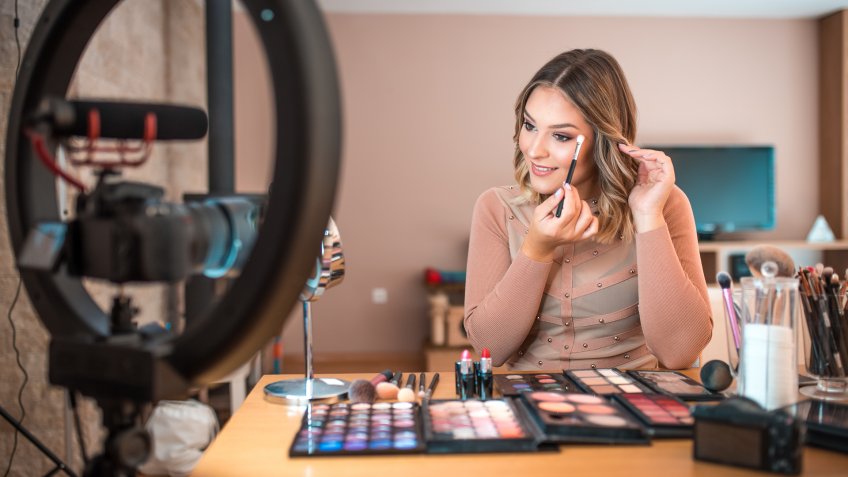 Young vlogger vlogging about make-up.