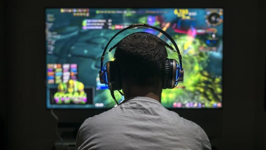 video game tester playing console game