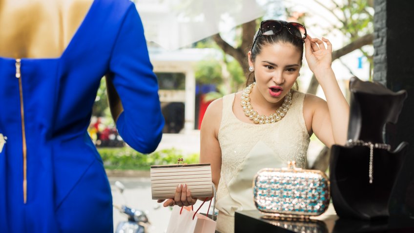 woman shopping for hand bags