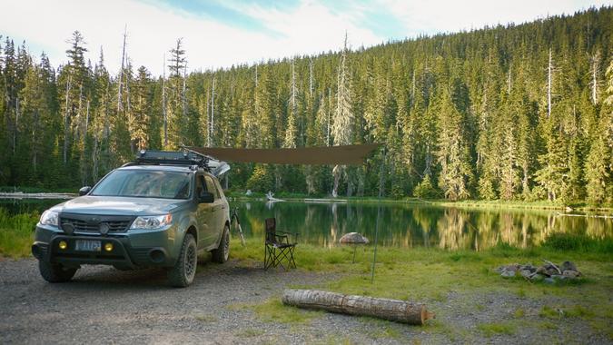 Willamette National Forest, Oregon, USA - July 13, 2018: A Subaru Forester modified for offroad use at a dispersed camping site next to a small lake in the Cascade Range.