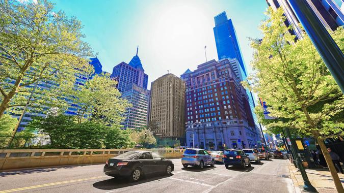 Philadelphia, USA - May 4, 2015: Traffic on JFK boulevard and Penn Center with skyline of skyscrapers in Philadelphia, Pennsylvania, USA.