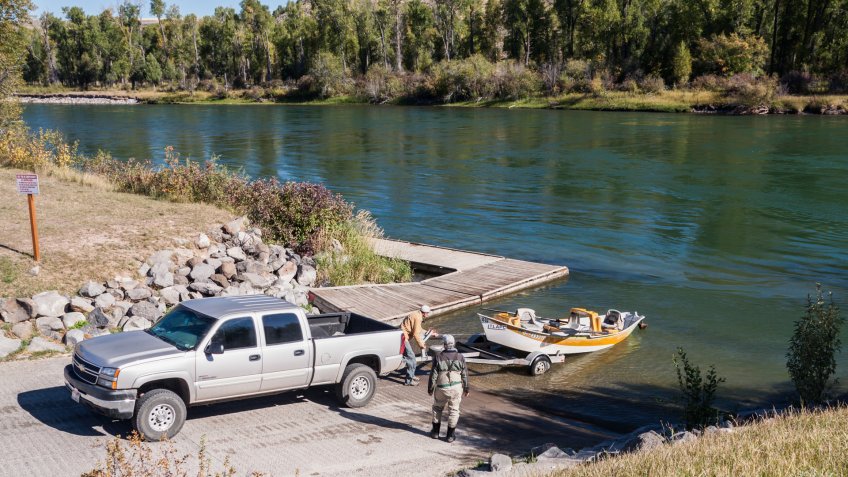Rigging, Idaho, USA - September 21, 2011: Two men are launching their boat at South Fork Salmon River.