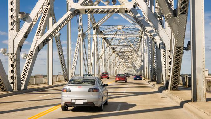 Traffic crossing an interstate highway four lane on a bridge over the Ohio River, Louisville, Kentucky, USA.