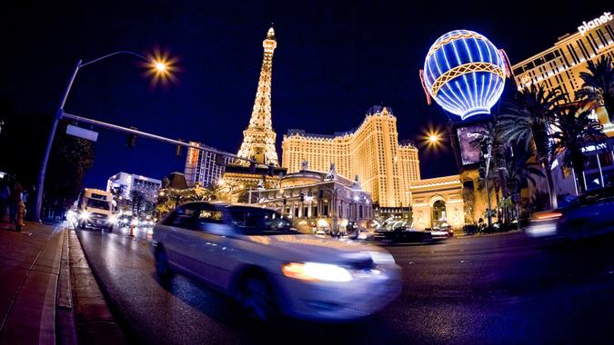 Las Vegas, Nevada, USA - March, 15 2009: cars driving on The Strip in front of the Paris Las Vegas Hotel Casino by night.