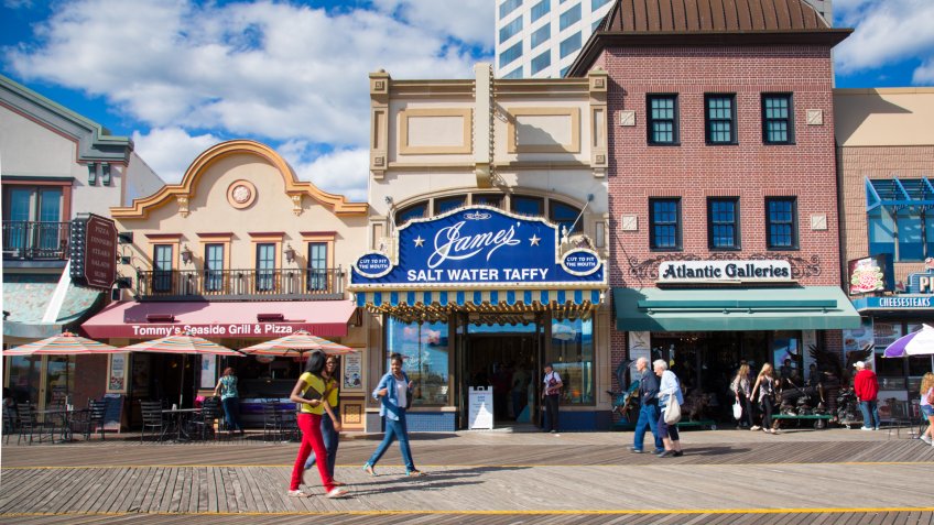 Atlantic City, New Jersey, USA - September 22, 2013: People walking the Atlantic City Boardwalk in NJ on September 22, 2013.