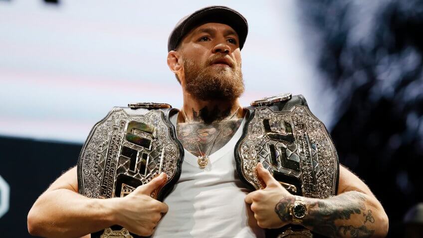 Mandatory Credit: Photo by John Locher/AP/Shutterstock (9915049c)Conor McGregor holds up belts during a news conference for the UFC 229 mixed martial arts bouts, in Las Vegas.