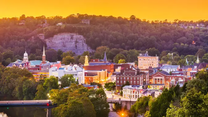 Frankfort, Kentucky, USA town skyline on the Kentucky River at dusk.