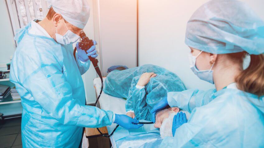 Gastroenterologist with patient