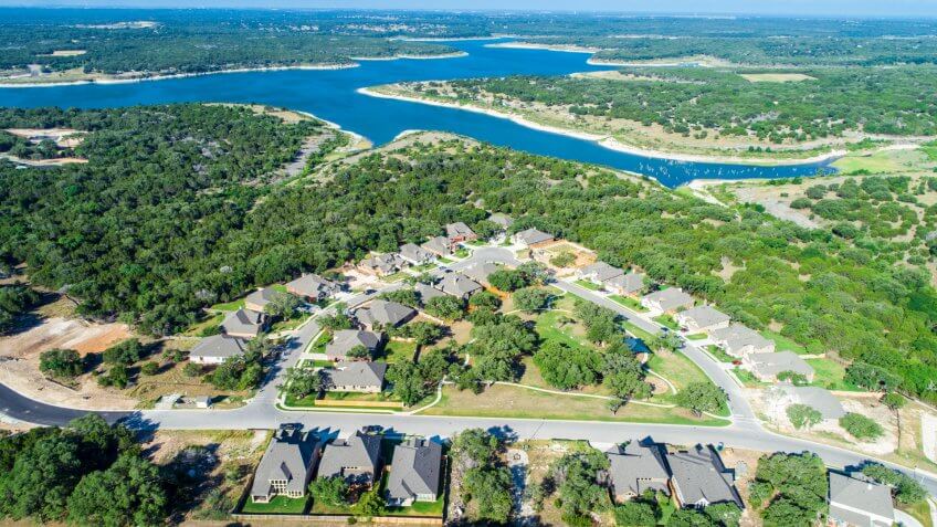 Georgetown , Texas , USA aerial drone suburb neighborhoods roads come together and take you home - lake property.