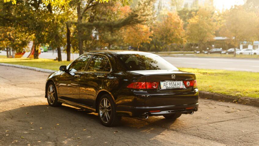 Dnipro, Ukraine - october 01, 2016: Honda Accord dark color on the walkway of Dnipro city street, autumn time.