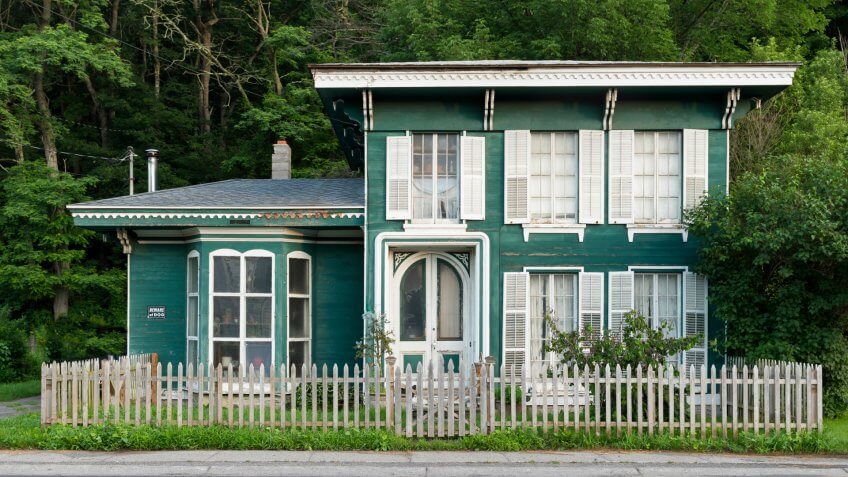 Green house in front of trees in Milford, Pennsylvania - Image.