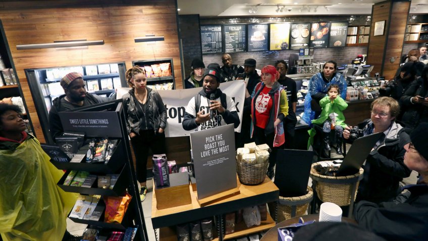 Mandatory Credit: Photo by Jacqueline Larma/AP/Shutterstock (9633941c)Demonstrators occupy the Starbucks that has become the center of protests, in Philadelphia.