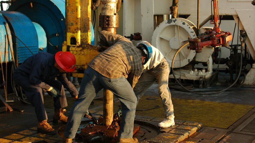 Rig crew making connection during drilling operations.