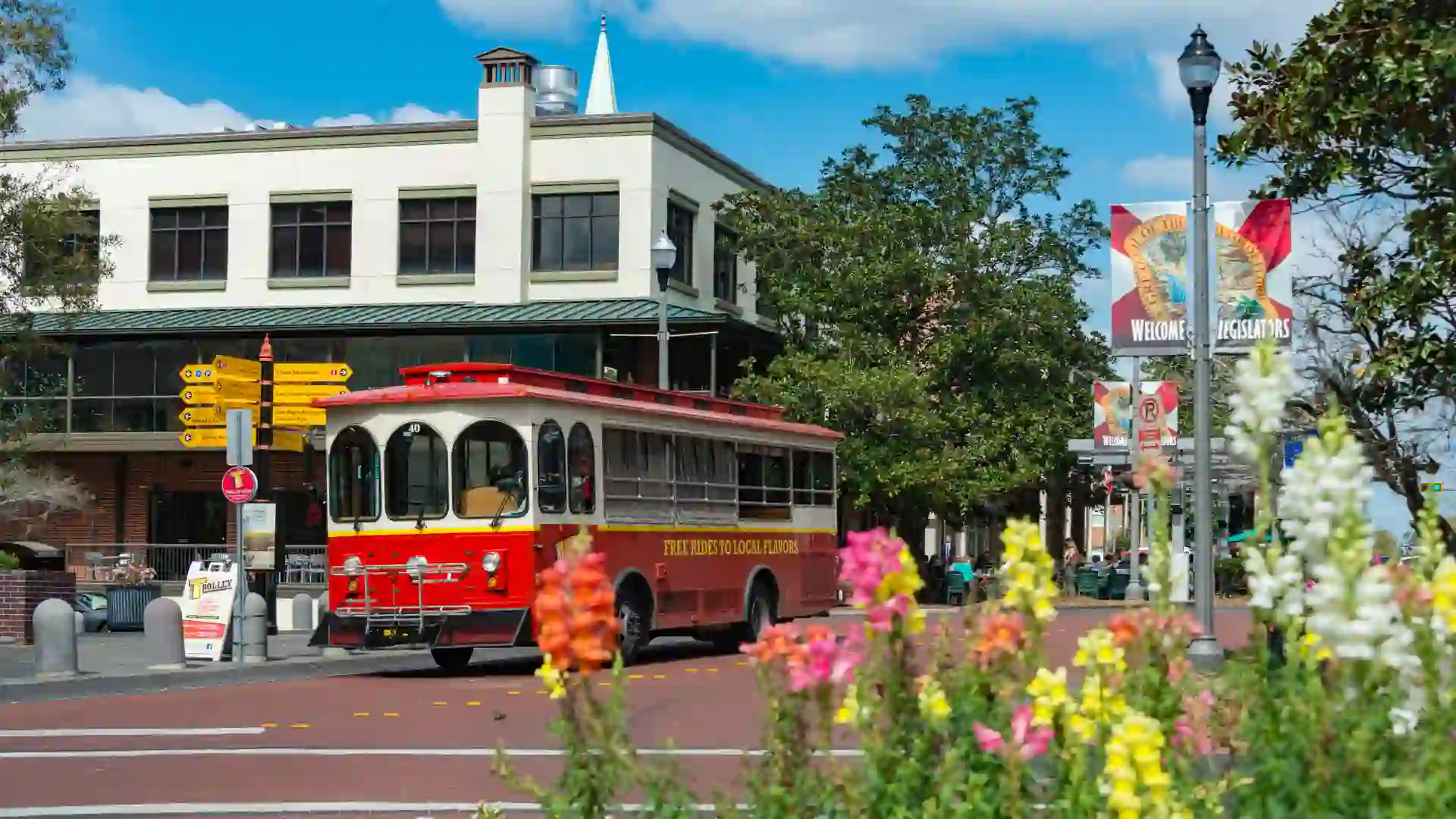 People on a street car on a sunny day in the picturesque downtown of Tallahassee, the capital city of the southern US state of Florida.