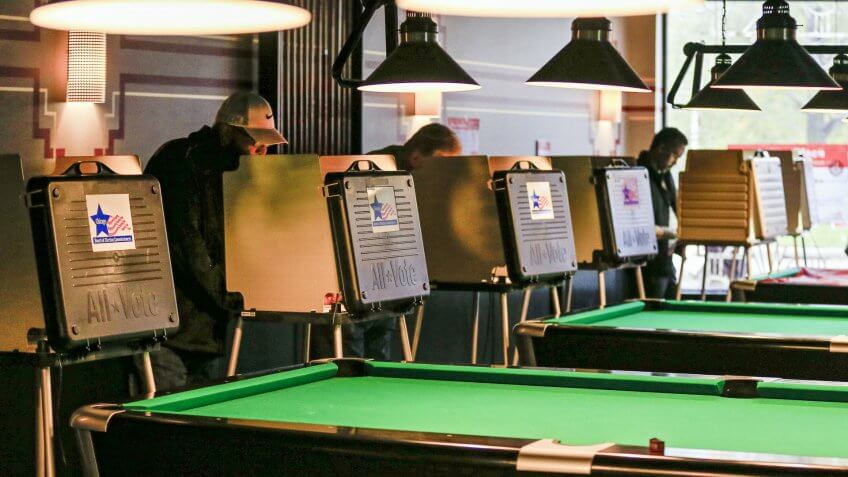 Voters Mark Their Paper Ballots Near a Row of Pool Tables at Pressure Billiards and Cafe in Chicago Illinois