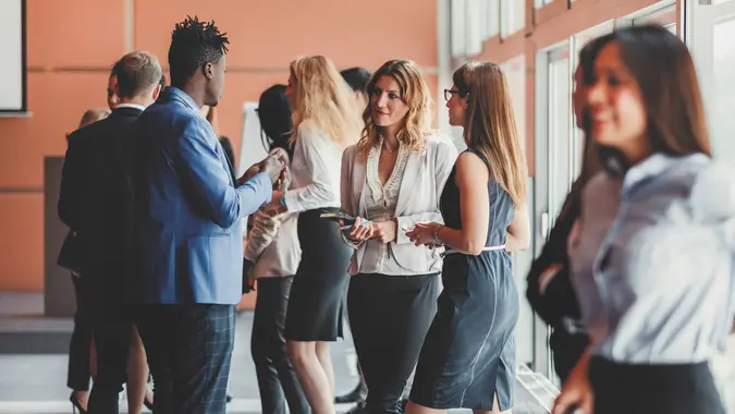 Business people standing in the conference room.