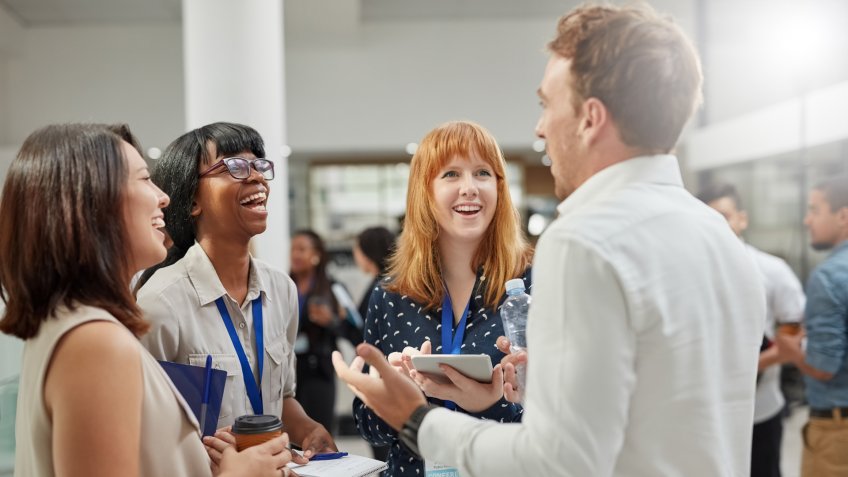 Cropped shot of a group of businesspeople having a conversation in an office.