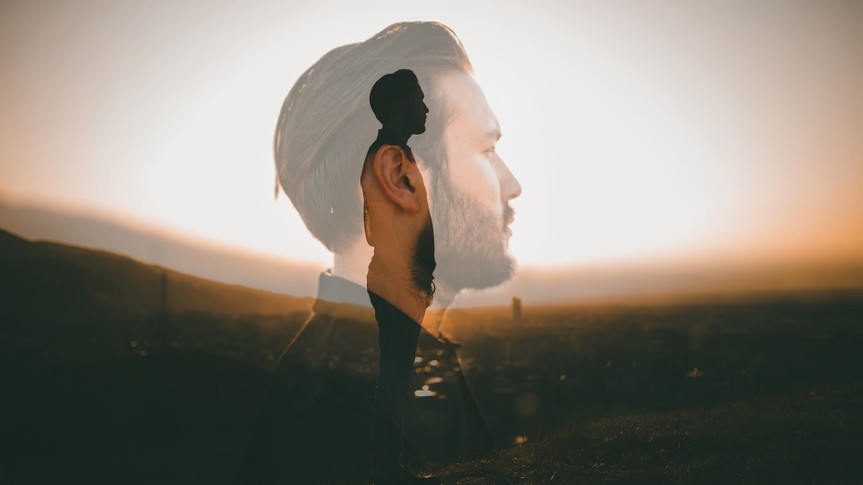 Portrait of a hipster with double exposure technique.