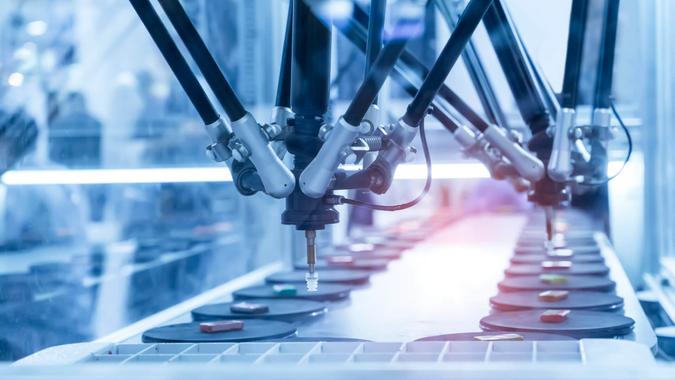 robotic pneumatic piston sucker unit on industrial machine,automation compressed air factory production - Image.