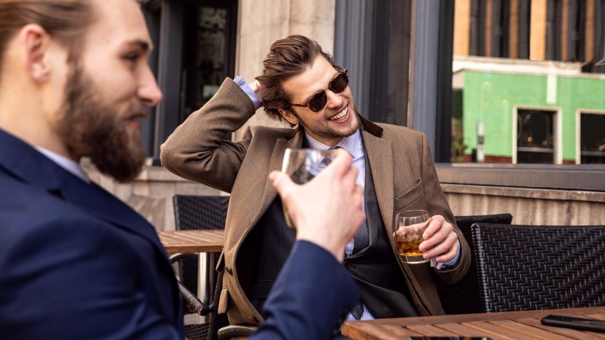 Business break - Two young businessmen taking a break in Central London.