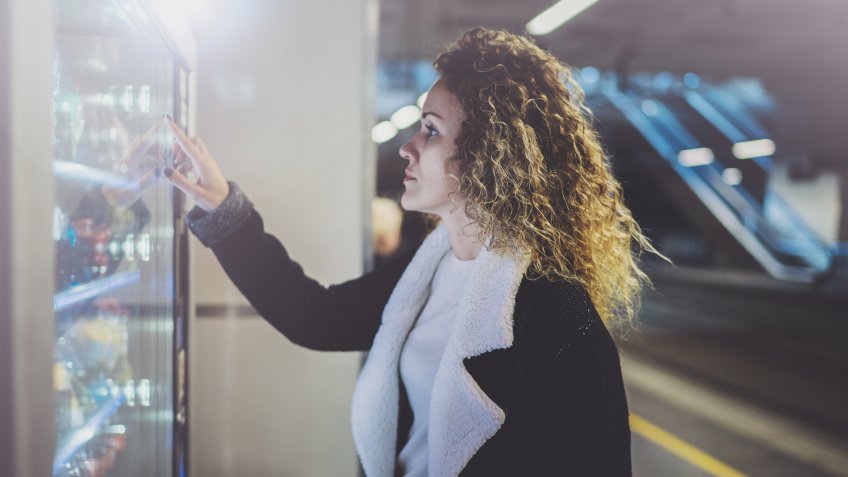 woman using vending machine