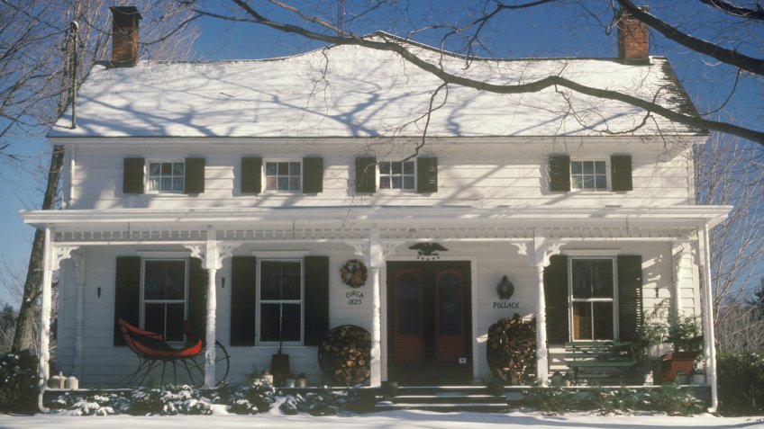 WOODSTOCK, NEW YORK - CIRCA 1980's: Snow covered two-story home at Christmas, Woodstock, NY - Image.