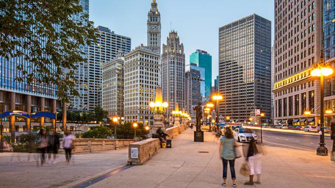 People visiting Chicago at dusk.