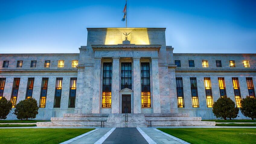 The Federal Reserve Building in downtown Washington DC, USA at night.
