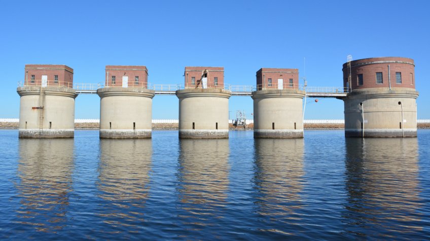 Reflections of the Lake Murray dam and columns in Lexington, South Carolina - Image.