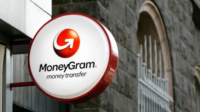 Reykjavik, Iceland, August 22, 2017: MoneyGram sign is mounted to a wall above the entrance to their branch.
