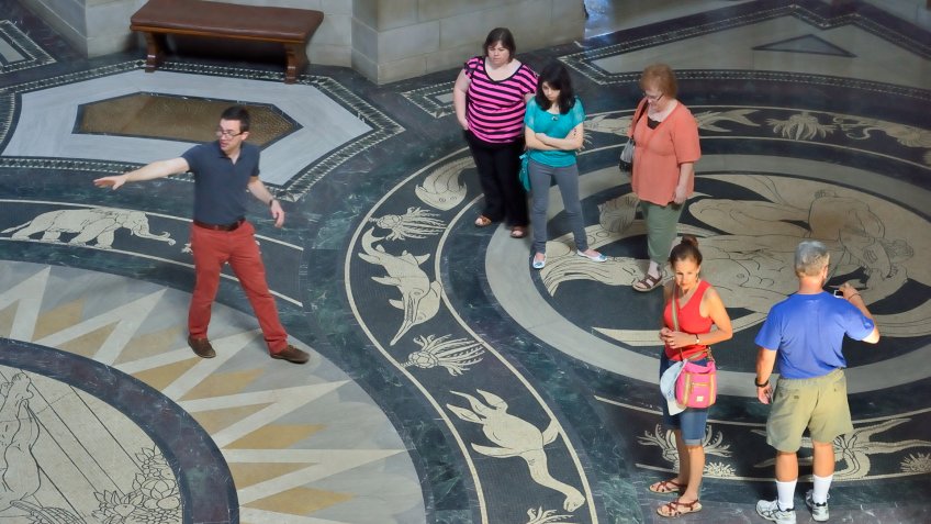 Lincoln, Nebraska, USA - July 9, 2013: People on a tour of the beautiful Nebraska State Capitol in Lincoln.