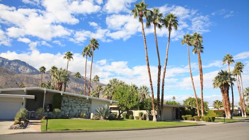 Neighborhood street with three homes.