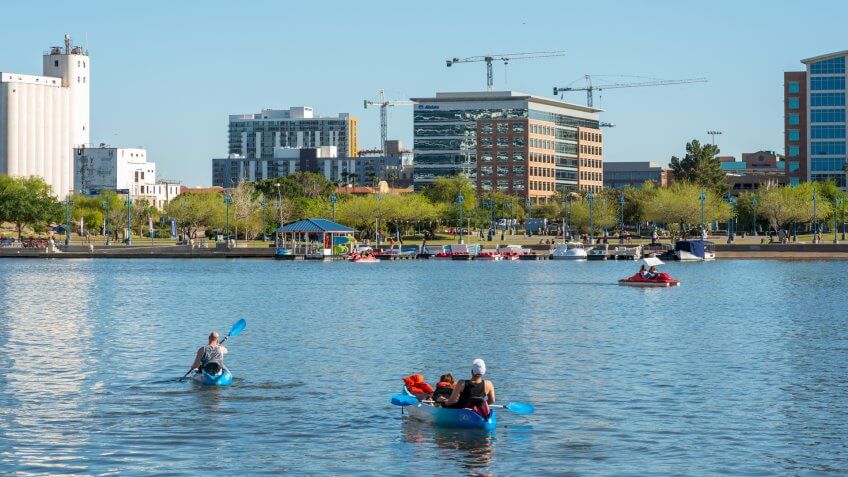 People in rental boats enjoy a sunny day on Tempe Town Lake in Arizona.