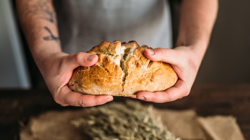 breaking baked bread