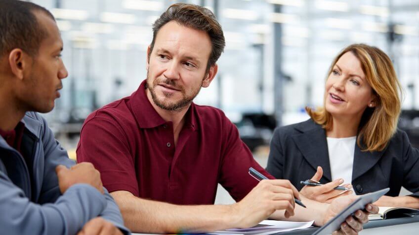 car dealer associate talking with customer