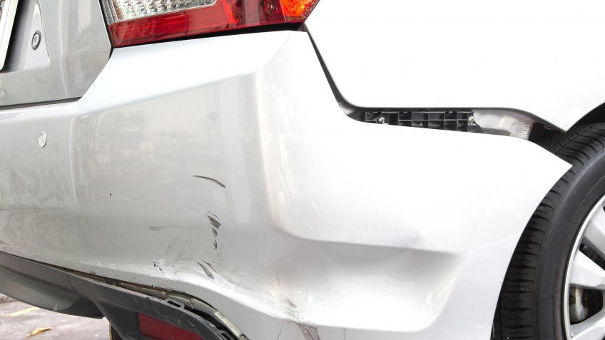 car with bumper falling off