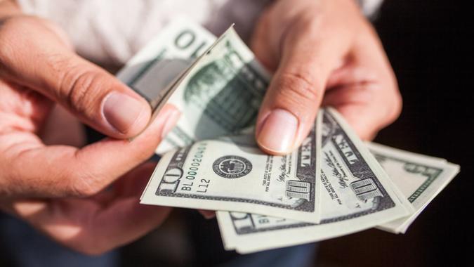 Usa dollars in hands.