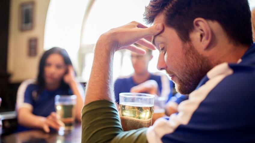 frustrated man with beer