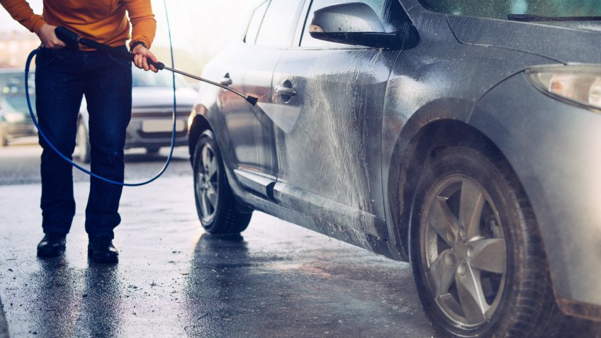 man washing his car