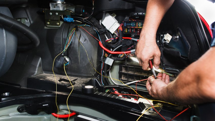 mechanic checking electrical wires