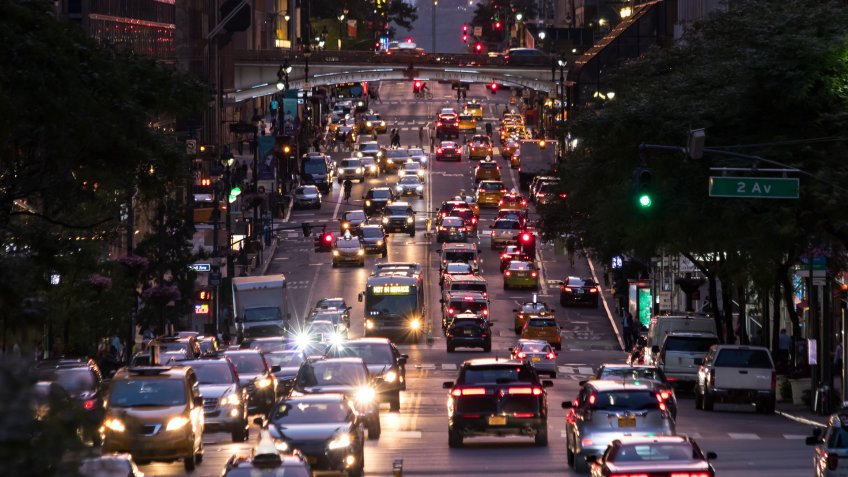 Lights from crosstown traffic on 42nd Street in Midtown Manhattan New York City.
