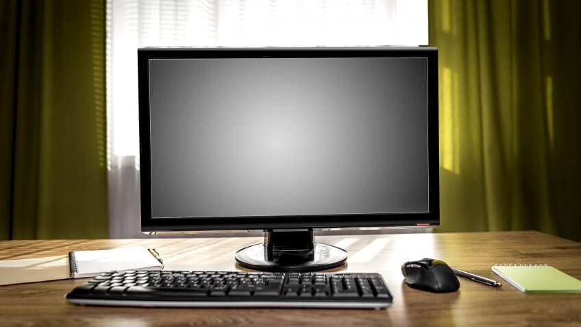 old computer on desk in house