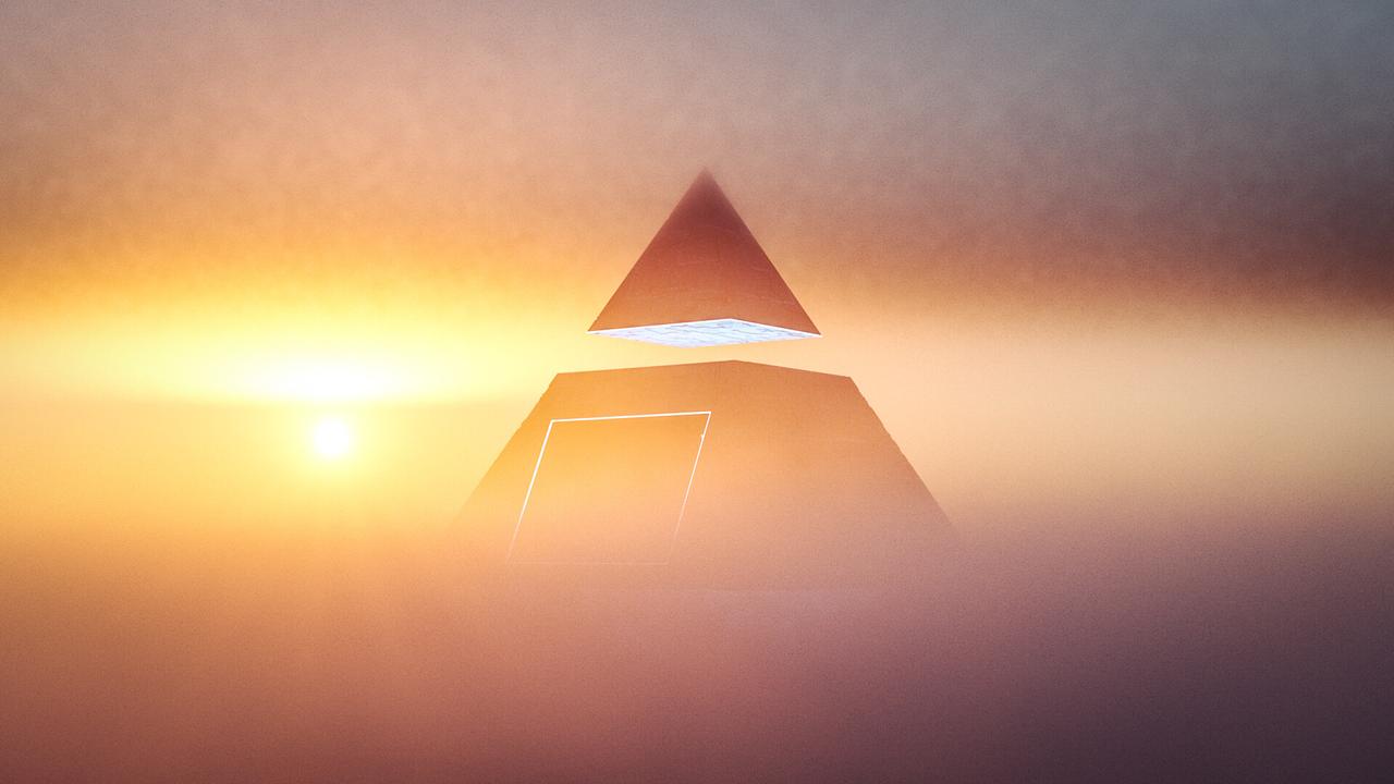 pyramid scheme concept at sunset