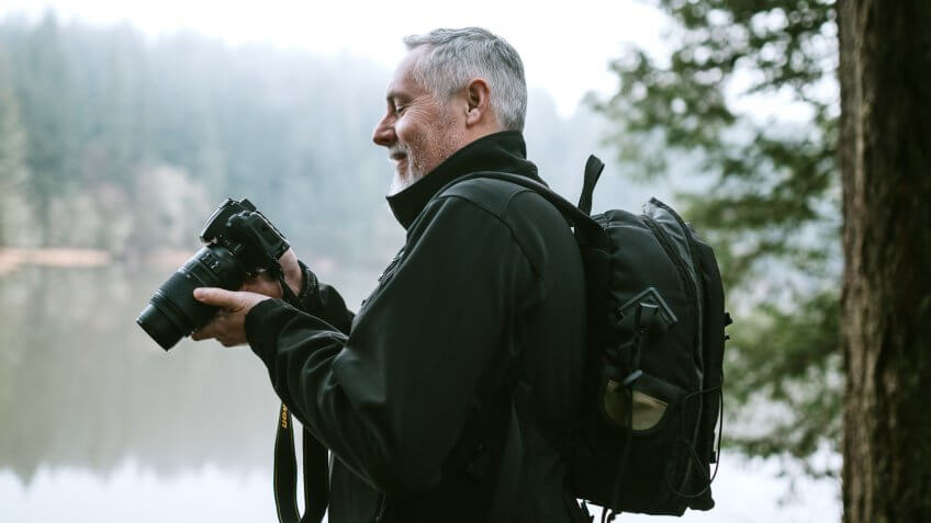 A man enjoys time outdoors in the Pacific Northwest, hiking beautiful forest trails and exploring rivers and waterfalls.