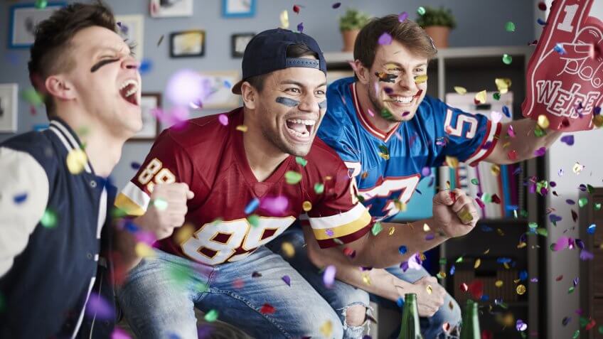 sports fans cheer after touchdown