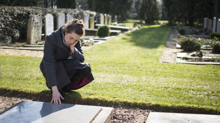 woman grieving in cemetary