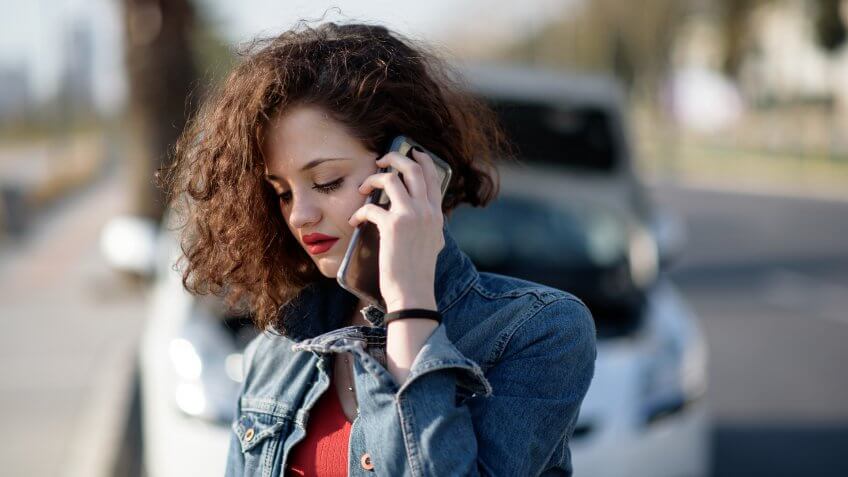 Unhappy woman with a broken car.
