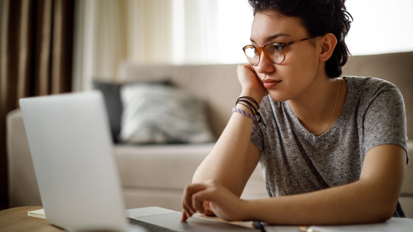Young woman working at home.