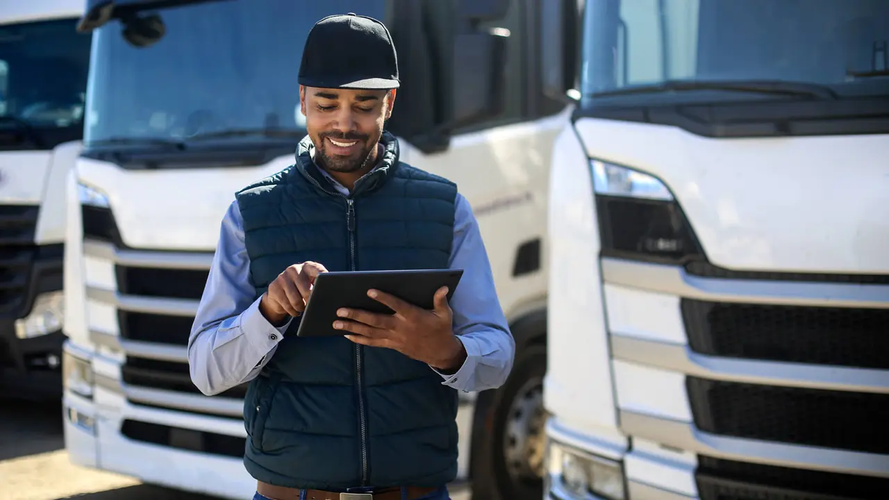 Truck driver using a tablet.
