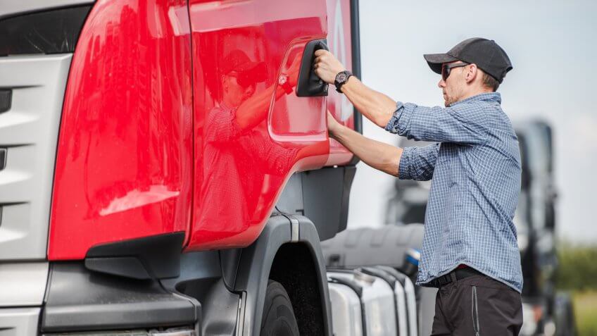 Caucasian Driver and His Euro Semi Truck.